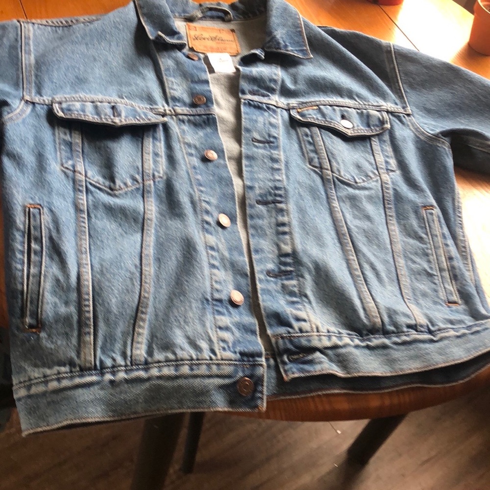 Levi Strauss Jean Jacket two small holes on back. Good condition